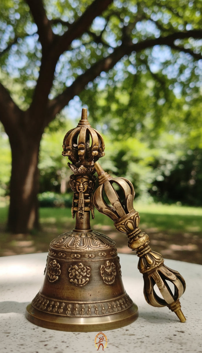 Astamangala bell featuring the Eight Auspicious Symbols and produces a clear, resonant tone ideal for puja and meditation.