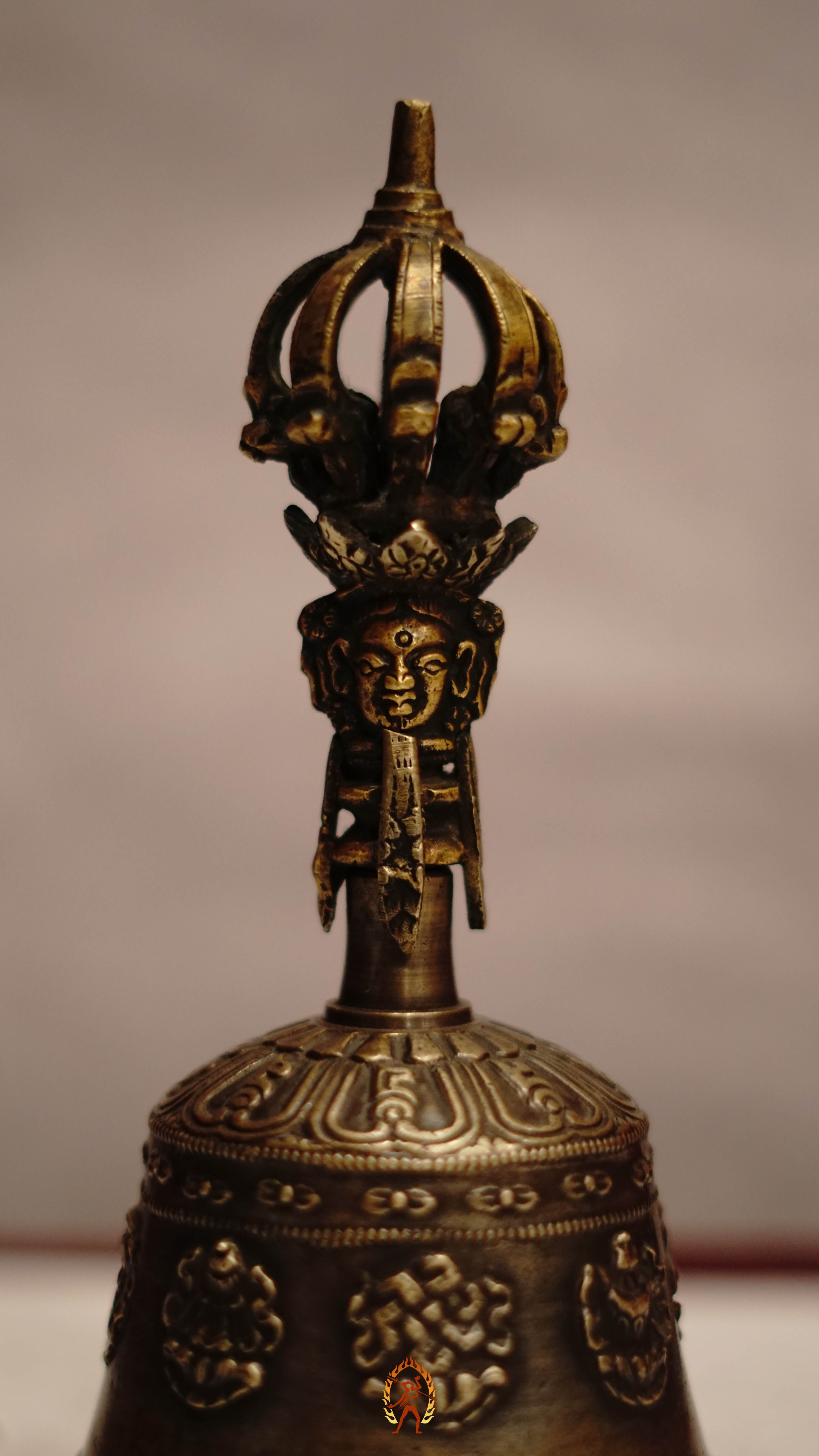 Astamangala bell featuring the Eight Auspicious Symbols and produces a clear, resonant tone ideal for puja and meditation.