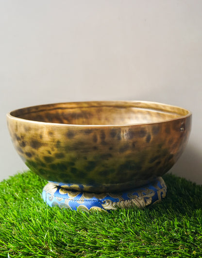 Hand-hammered Tiger Style Tibetan Singing Bowl from Kathmandu Nepal with tiger stripe patterns, used in Buddhist meditation, sound healing, and Himalayan mindfulness practice.