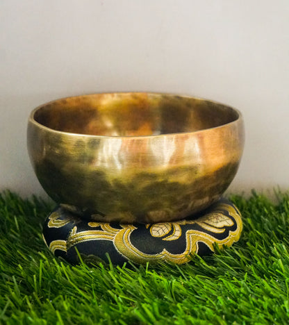 Hand-hammered Tiger Style Tibetan Singing Bowl from Kathmandu Nepal with tiger stripe patterns, used in Buddhist meditation, sound healing, and Himalayan mindfulness practice.