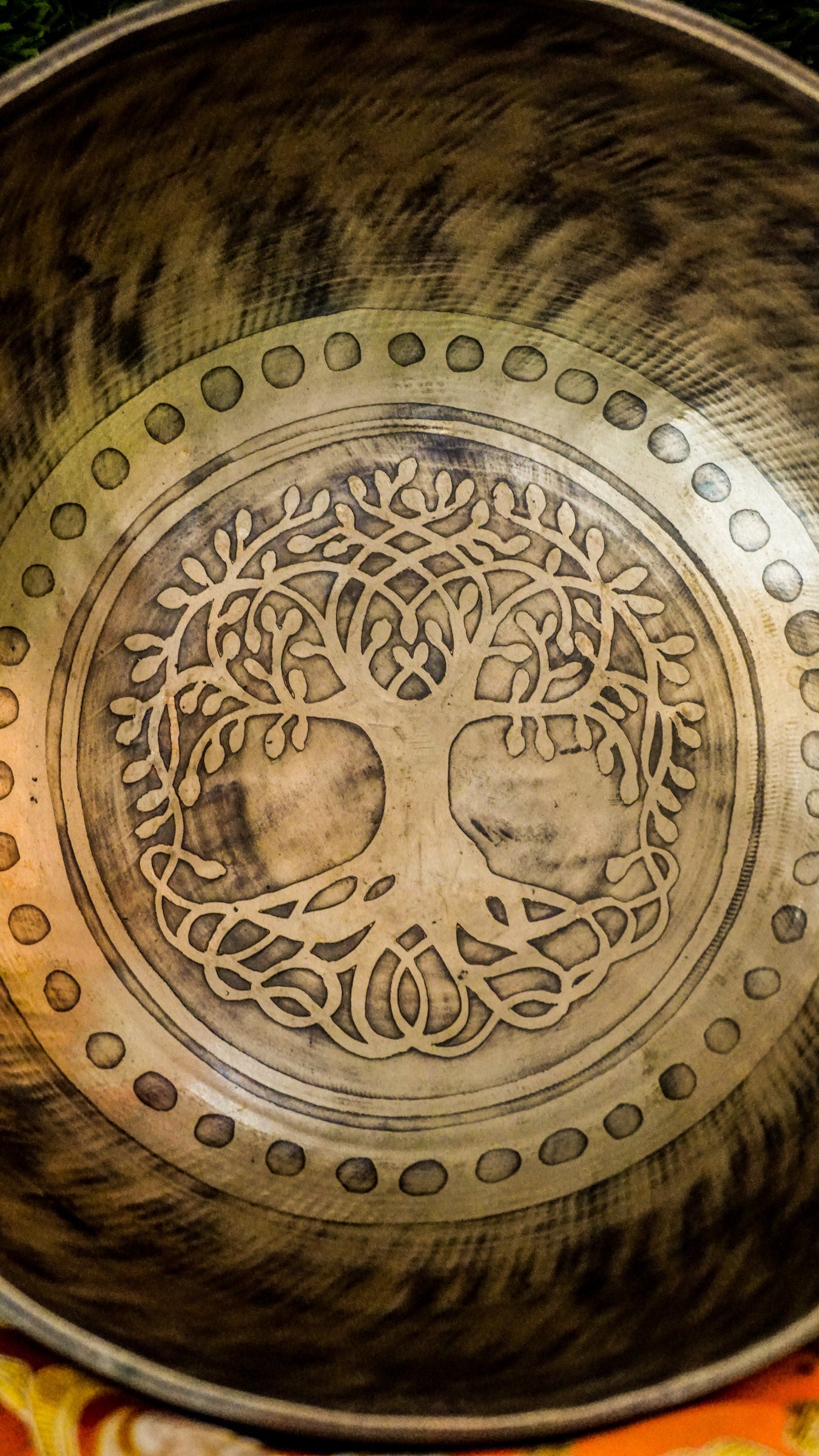 The Tree Singing Bowl features a graceful tree symbol at its center, representing growth, balance, and grounded strength. Floral patterns on the outside add calm and beauty. Its deep and soothing sound supports relaxation, focus, and connection, making it ideal for meditation or creating a peaceful space.
