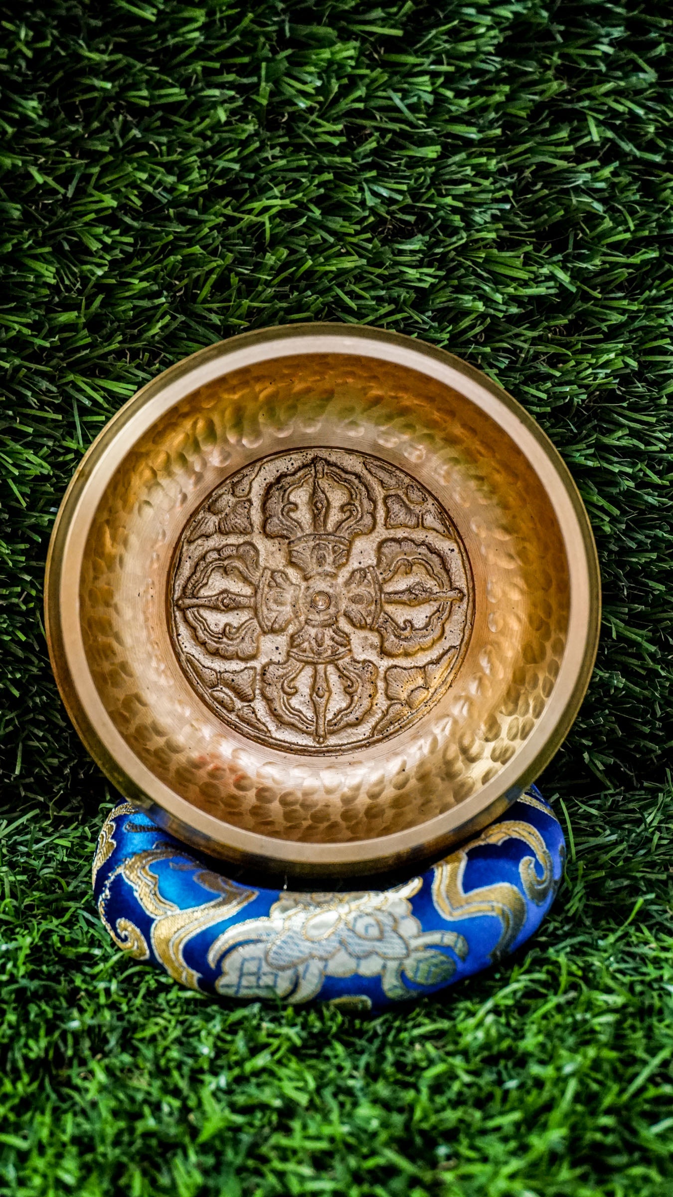 
The Dotted Vajra Singing Bowl brings steady, grounding energy to your space. Inside rests the Vajra symbol, representing spiritual power, truth, and balance between compassion and wisdom. The bowl’s subtle dotted texture keeps the design natural and simple, letting its clear, calming tones shine. Perfect for meditation or intention setting, it offers quiet strength and helps you reset and realign with ease.