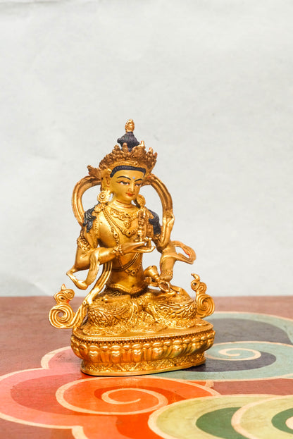 Invite purity and spiritual cleansing with this handcrafted Vajrasattva statue. Depicted in the diamond posture, holding a vajra and bell symbolizing wisdom and compassion. This statue inspires inner clarity and spiritual renewal.