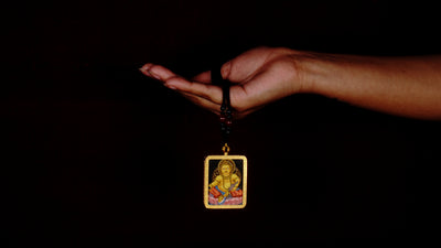Yellow Zambala Ghau Thangka Pendant – Hand-Painted Newari Prosperity Amulet