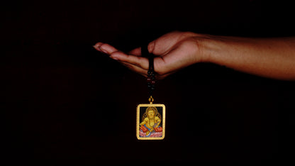 Yellow Zambala Ghau Thangka Pendant – Hand-Painted Newari Prosperity Amulet