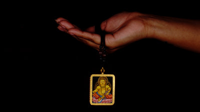 Yellow Zambala Ghau Thangka Pendant – Hand-Painted Newari Prosperity Amulet
