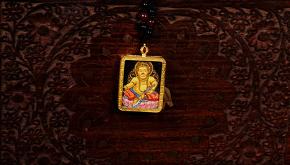 Yellow Zambala Ghau Thangka Pendant – Hand-Painted Newari Prosperity Amulet