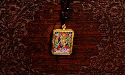 Hand-painted Yellow Zambala miniature Thangka pendant in gold-accented copper Ghau locket with black beaded cord.