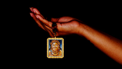 Hand-painted Zambala portrait miniature Thangka pendant in gold-accented copper Ghau locket with black beaded cord.