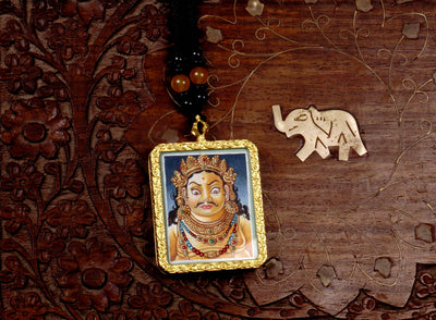 Hand-painted Zambala portrait miniature Thangka pendant in gold-accented copper Ghau locket with black beaded cord.