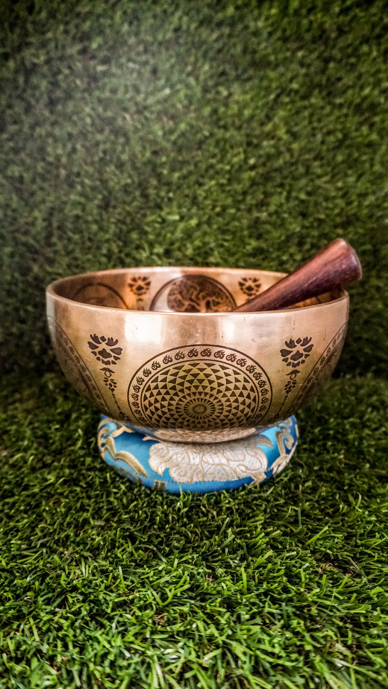 Handcrafted Yin Yang singing bowl with engraved Yin Yang symbol inside and flowing linework outside; includes wooden mallet and silk cushion, producing calming tones for balance, harmony, and meditation.