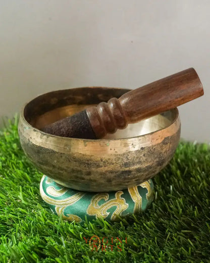 Semi-antique handmade Tibetan singing bowl with simple design, crafted in Nepal for meditation, Buddhist art, and sound healing.