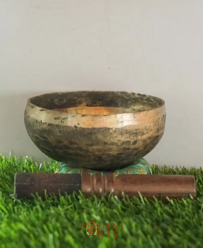 Semi-antique handmade Tibetan singing bowl with simple design, crafted in Nepal for meditation, Buddhist art, and sound healing.