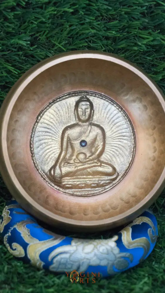 Invite mindfulness and calm with our handcrafted Dotted Buddha Singing Bowl. Featuring an engraved Buddha surrounded by a dotted mandala symbolizing stillness and spiritual balance, this bowl reminds you to stay present. Traditional mantras circle the rim, adding protection and spiritual energy. Handcrafted by skilled Himalayan artisans, it produces soothing tones that quiet the mind and support meditation, breathwork, and daily mindfulness practice.








