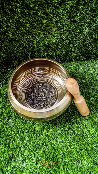 The Buddha Mandala Bronze Singing Bowl features a meditating Buddha inside a sacred mandala with the Om Mani Padme Hum mantra outside. Its soothing tones promote peace, focus, and spiritual balance and are perfect for meditation and grounding your space.