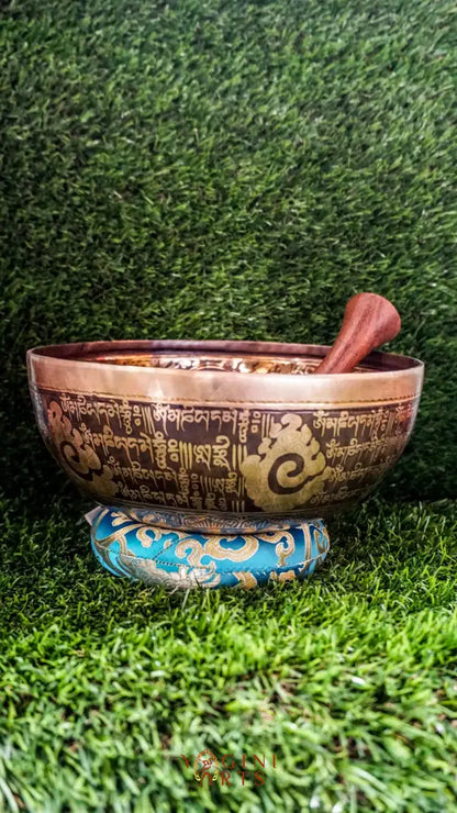 The Buddha Singing Bowl features a serene Buddha at the center surrounded by Om Mani Padme Hum syllables, with the full mantra on the outside. It produces a deep, steady tone that promotes calm, mindfulness, and inner peace. Perfect for meditation and reflection. Includes wooden mallet and silk cushion.