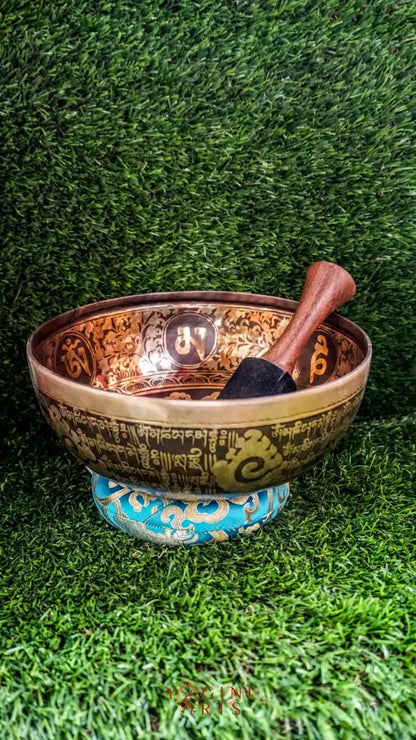 The Buddha Singing Bowl features a serene Buddha at the center surrounded by Om Mani Padme Hum syllables, with the full mantra on the outside. It produces a deep, steady tone that promotes calm, mindfulness, and inner peace. Perfect for meditation and reflection. Includes wooden mallet and silk cushion.