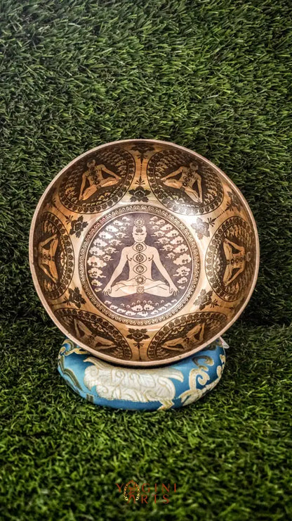 Awaken and balance your inner energies with our handcrafted Chakra Manab Singing Bowl. Featuring detailed engravings of the seven chakras and sacred Sanskrit mantras, this bowl supports spiritual growth, healing, and protection. Hand-hammered by skilled Himalayan artisans, it produces rich, clear tones that help clear energy blockages and promote chakra alignment. Ideal for meditation, sound healing, and holistic wellness, it is a meaningful companion on your spiritual journey.