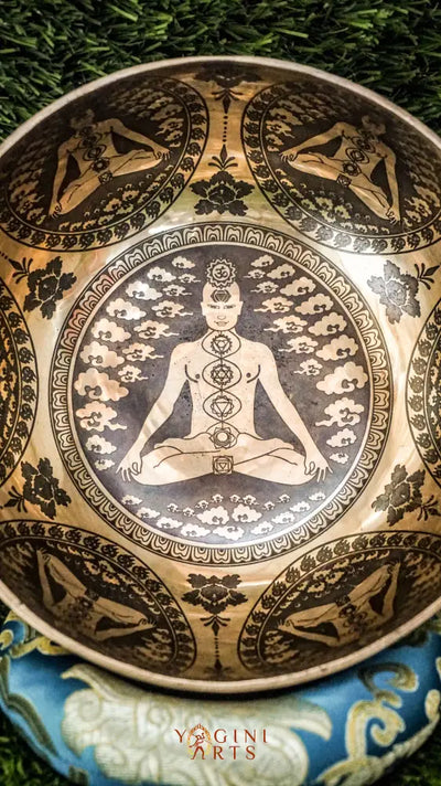 Awaken and balance your inner energies with our handcrafted Chakra Manab Singing Bowl. Featuring detailed engravings of the seven chakras and sacred Sanskrit mantras, this bowl supports spiritual growth, healing, and protection. Hand-hammered by skilled Himalayan artisans, it produces rich, clear tones that help clear energy blockages and promote chakra alignment. Ideal for meditation, sound healing, and holistic wellness, it is a meaningful companion on your spiritual journey.