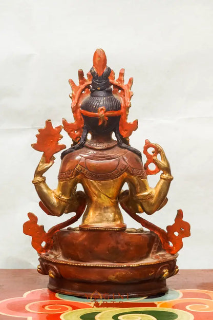 Chenrezig statue depicts the Bodhisattva of Compassion in four-armed form seated on a lotus pedestal.  Ideal for meditation altars or spiritual decor, it inspires mindfulness, healing, and heartfelt compassion in any space.