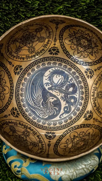 Balance yin and yang with our handcrafted Dragon and Phoenix Singing Bowl. Featuring the dragon and phoenix inside, it symbolizes strength, renewal, and harmony. Sacred mantras around the rim enhance your meditation space with peace and spiritual energy. Handmade by skilled artisans, it produces rich, balanced tones perfect for mindfulness, healing, and rituals. Compact and powerful, it fits beautifully in any sacred space or travel kit.