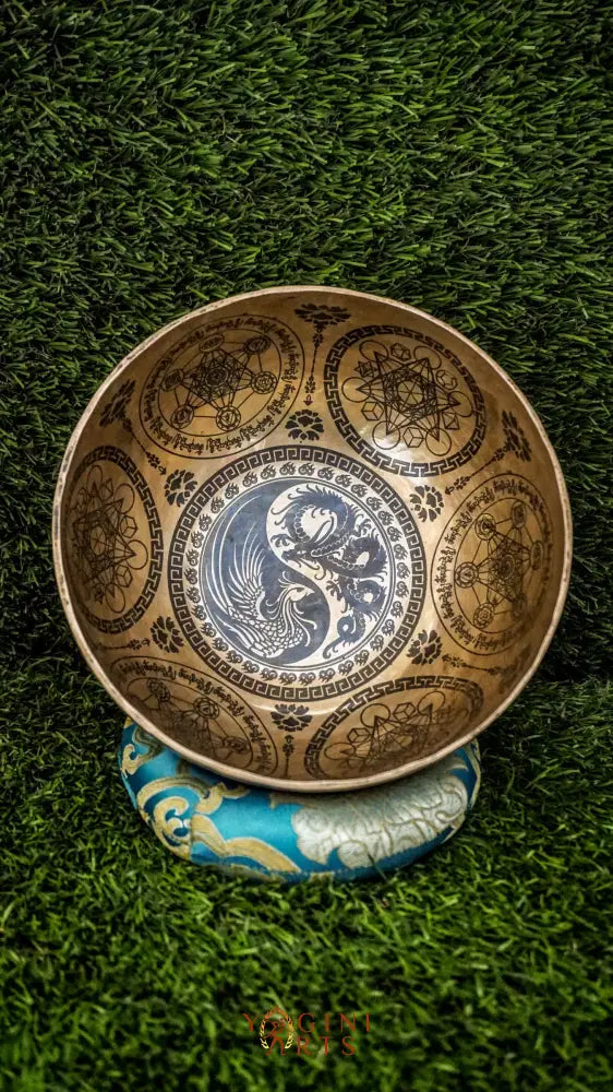 Balance yin and yang with our handcrafted Dragon and Phoenix Singing Bowl. Featuring the dragon and phoenix inside, it symbolizes strength, renewal, and harmony. Sacred mantras around the rim enhance your meditation space with peace and spiritual energy. Handmade by skilled artisans, it produces rich, balanced tones perfect for mindfulness, healing, and rituals. Compact and powerful, it fits beautifully in any sacred space or travel kit.