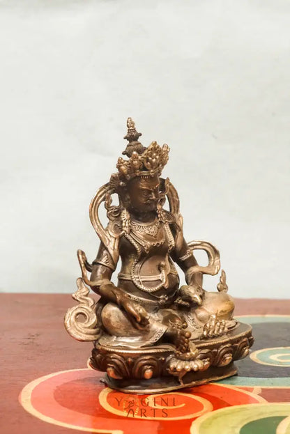 The Zambala statue known as the Buddhist deity of prosperity, Zambala holds a jewel-spitting mongoose and treasure vase and it’s perfect for spiritual spaces or thoughtful gifts.