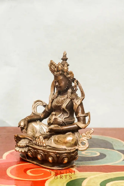 The Zambala statue known as the Buddhist deity of prosperity, Zambala holds a jewel-spitting mongoose and treasure vase and it’s perfect for spiritual spaces or thoughtful gifts.