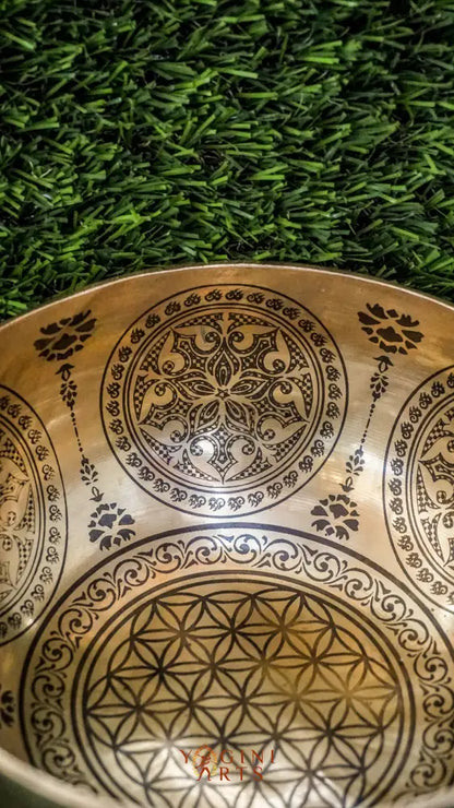 Bring balance and harmony to your space with our handcrafted Flower Mandala Singing Bowl. Featuring a detailed flower mandala inside and symmetrical patterns outside, it symbolizes spiritual growth and unity. Each clear, soothing tone supports meditation, mindfulness, and emotional clarity. Handcrafted by skilled artisans, this bowl is perfect for your altar or on-the-go practice. Includes a wooden mallet and silk cushion for easy use and care.