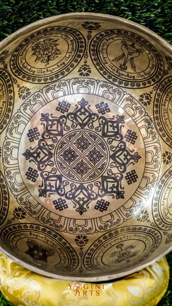 The Flower Singing Bowl features a central lotus flower and the eight sacred Astamangala symbols, all arranged in a harmonious, floral rhythm. Surrounded by delicate mandala motifs, it creates a steady, calming sound that supports meditation and brings sacred beauty into your space.