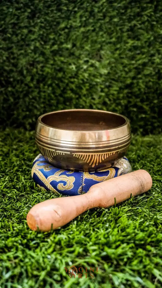 Invite harmony, balance, and positive energy with our handcrafted Flower of Life Singing Bowl. Featuring the sacred Flower of Life symbol inside and intricate geometric patterns outside, it represents unity and the cycle of life. Handmade by skilled artisans, this bowl produces clear, calming tones that support meditation, relaxation, and emotional balance. Includes a wooden mallet and silk cushion. Perfect for any meditation space or spiritual journey.