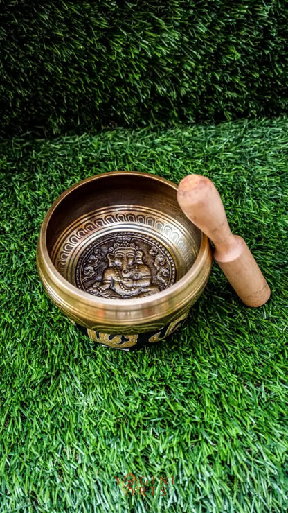 The Ganesh Singing Bowl carries the energy of new beginnings and wisdom. With Lord Ganesh carved at its center, it symbolizes success, protection, and clarity. Simple outer patterns keep the focus on this sacred figure. Its smooth, grounding tone calms the mind and supports meditation or intention setting, making it a meaningful companion for strength and mindful energy.