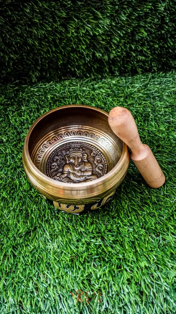 The Ganesh Singing Bowl carries the energy of new beginnings and wisdom. With Lord Ganesh carved at its center, it symbolizes success, protection, and clarity. Simple outer patterns keep the focus on this sacred figure. Its smooth, grounding tone calms the mind and supports meditation or intention setting, making it a meaningful companion for strength and mindful energy.