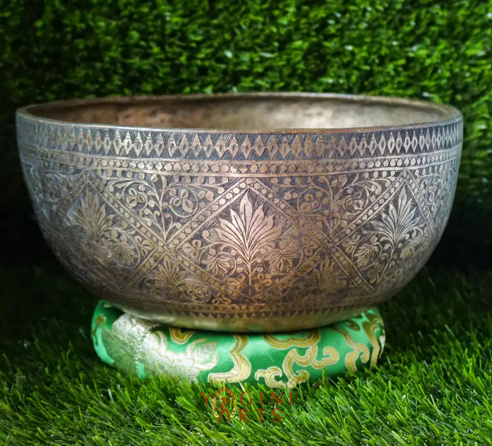 Handcrafted Flower Carved Singing Bowl from Nepal with floral designs, used for meditation, mindfulness, and sound healing.