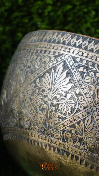Handcrafted Flower Carved Singing Bowl from Nepal with floral designs, used for meditation, mindfulness, and sound healing.
