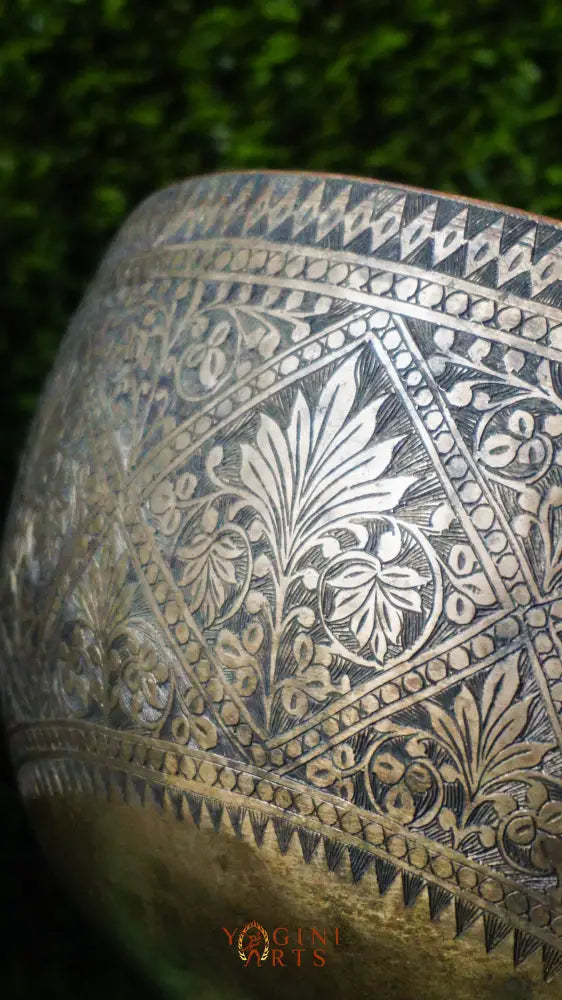 Handcrafted Flower Carved Singing Bowl from Nepal with floral designs, used for meditation, mindfulness, and sound healing.