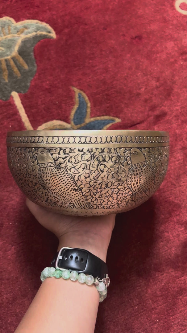 Semi antique singing bowl with engraved bird and floral design, handcrafted in Nepal