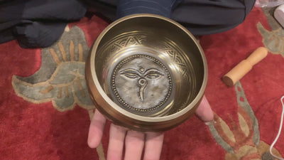 The Carved Buddha Eye Singing Bowl features the Buddha Eye symbol for spiritual clarity and protection. The Om Mani Padme Hum mantra circles the outside on mandala petals. Its clear, calming tones support meditation and mindfulness, bringing peace and focus to any space.