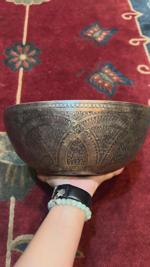 Semi antique singing bowl with intricate arch and floral engraved patterns in an aged bronze finish