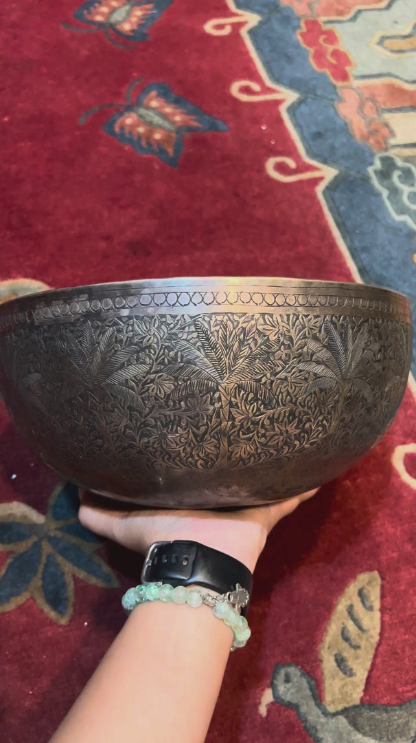 Semi antique Tibetan singing bowl with intricate floral and foliage engraving, handcrafted in Nepal