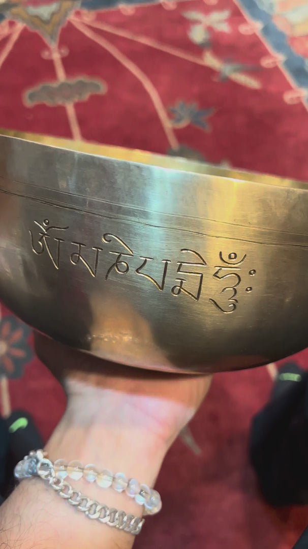 Handcrafted Buddha Singing Bowl from Nepal with engraved Buddha design for meditation and mindfulness