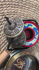 Mantra singing bowl meditation set with Ashtamangala tingsha, wooden mallet, cushion and Buddhist accessories from Nepal