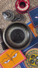Handcrafted Green Tara bronze singing bowl with raised Buddhist figure and engraved interior