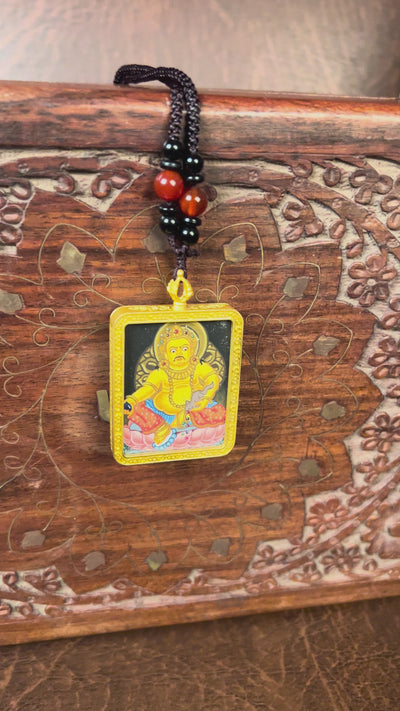 Yellow Zambala Ghau Thangka Pendant – Hand-Painted Newari Prosperity Amulet
