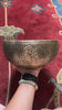 Semi antique singing bowl with circular floral and leaf engraving, traditional Himalayan design