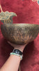 Semi antique floral engraved Tibetan singing bowl handcrafted in Nepal with detailed botanical patterns and antique bronze finish