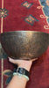 Semi antique singing bowl with intricate star-shaped floral engraving and traditional botanical patterns