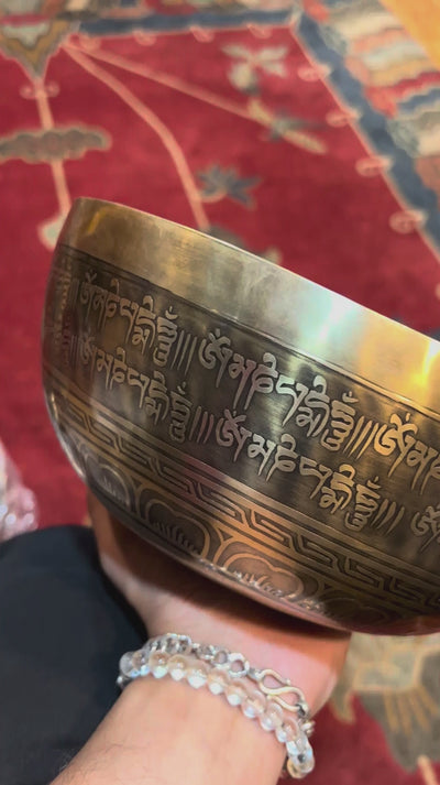 Handmade Nepal singing bowl with Shakyamuni Buddha carved on the outside, for meditation and sound healing