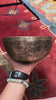 Semi antique handmade singing bowl with intricate floral engravings and aged bronze finish from Nepal