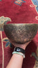 Semi antique floral engraved singing bowl with intricate flower and leaf patterns and an antique bronze finish